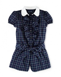 This preppy romper is crafted in classic plaid and features a club collar, a pretty ruffled placket and a matching sash for the perfect collegiate look.