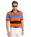 It only seems like you work hard at looking good with this lightweight, striped performance polo shirt from Izod.