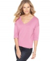 Cable & Gauge gives a basic piece a new look: this V-neck sweater features chic buttons along the back!