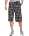 Pump up your casual wardrobe for solid warm-weather style in these plaid shorts from Calvin Klein.