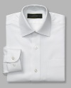 Classic dress shirt with spread collar and two pockets. Button front closure. Made with a little stretch that will move with him and retain its shape after washing.
