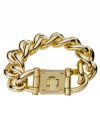 Put this designer style under lock and key. Flaunt bold, flashy links with an intricate lock clasp in this totally-glam bracelet by Michael Kors. Crafted in gold tone mixed metal. Approximate length: 8 inches.