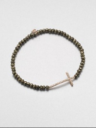A delicate diamond accented 14k rose gold cross on a stunning pyrite beaded stretch bracelet. Diamonds, .14 tcw14k rose goldPyriteDiameter, about 2.5Slip-on styleImported 