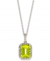 A green sensation. This unique emerald-cut peridot pendant (2 ct. t.w.) stands out against a halo of round-cut diamond accents. Set in 10k white gold. Approximate length: 18 inches. Approximate drop: 3/4 inch.