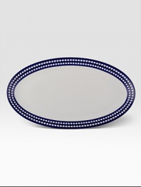 From the Perlee Bleu collection, inspired by the blue horizons and white domes of the Grecian Islands, this versatile platter is perfect for casual dining or entertaining.Hand-painted Limoges porcelain21 X 12Dishwasher safeMade in Portugal