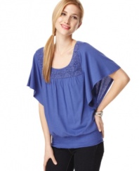 Flowing and fabulous, this top from Style&co. hits all the right notes for spring. A crochet-front yoke and bold color give it pop!