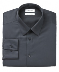 Versatility and dependability. That's what this smart, slim-fitting dress shirt from Calvin Klein offers. Constructed with non-iron fabric and finished with flawless attention to detail, you can't go wrong with this stylish button-down.