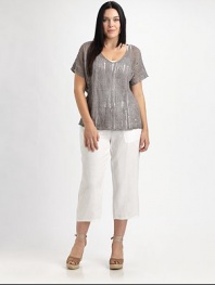Shimmer and shine in this airy knit enhanced by metallic thread. It also features a feminine neckline and beloved fit.V-neckShort sleevesPull-on styleAbout 23 from shoulder to hem83% linen/16% metallic thread/1% cottonHand washImported of Italian fabric