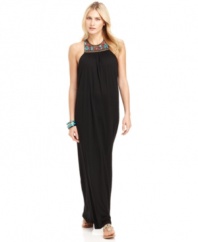Southwestern-inspired beading along the neckline of this halter maxi dress offers a bit of bohemian flair to this relaxed look from MICHAEL Michael Kors.
