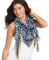 Bold color and an even bolder pattern. Layer on this Nine West triangle scarf as a light layer with heavy impact.