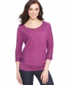 Featuring a draped, slouchy style with a chic banded hem, this top from DKNY Jeans is an everyday essential!