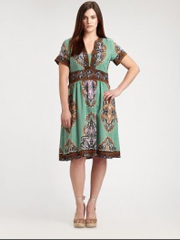 Its Aztec-inspired print makes this dress a statement piece. The classic Empire waist helps to create a flawless hourglass silhouette. Feminine necklineShort sleevesAllover printContrast trimConcealed back zipperAbout 29 from natural waist60% silk/40% polyesterDry cleanMade in USA of imported fabric
