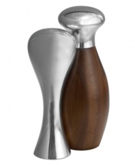 Feast your eyes on the Gourmet Monroe salt and pepper set. Nambe metal hugs acacia wood in everyday essentials that defy the ordinary. Designed by Neil Cohen.