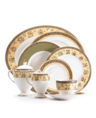 Deep blues and vibrant yellows combine with exotic florals to form a pattern that is rich in color and design. The exquisite detail and simple shape of this accent plate (shown middle) make this bone china collection ideal for any occasion.