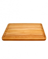 This handsome, substantial cutting board is twice as useful as a standard cutting board. One side features a convenient juice groove around the entire surface for collecting savory juices, perfect for homemade gravies and sauces, while slicing meats. The other side is smooth, perfect for chopping vegetables. Premium edge-grain construction and a rich, oiled finish deliver years of use. One-year warranty.