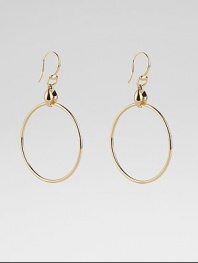 From the Marina Collection. A polished, tubular hoop suspends from a distinctively sculpted link. 18k yellow gold Diameter, about 1½ Ear wire Made in Italy