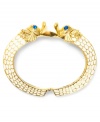 Slip on some sea-creature sass. Betsey Johnson's hinge bangle bracelet features sea horse details and blue-crystal accents. Set in ivory and gold tone mixed metal. Approximate diameter: 2-1/2 inches.
