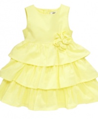 A ray of sunshine. She'll brighten up everyone's day in this lovely tiered-ruffle dress from DKNY.