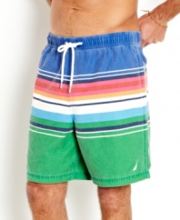 Faded glory. The subtle fade on these striped swim trunks from Nautica make them the perfect trunks to make summer memories in.
