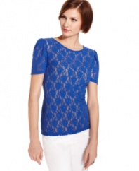 Style&co. gives this sweet lace top a dash of daring with slightly puffed sleeves. Try this sheer style with a cami and pencil skirt for a stylish work ensemble or wear on the weekend to dress up denim.