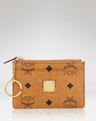 Key takeaway: statement accessories like this card case from MCM. Crafted of coated canvas and splashed with the brand's motif, it's a luxe way to work statement style.