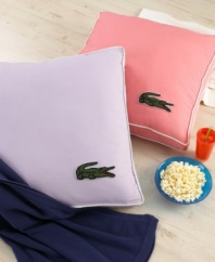 Recline in style! The perfect oversized pillow for lounging features a hip embellished Lacoste croc in the corner. (Clearance)