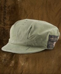 A military-inspired favorite embodies the character of a rugged original in soft cotton with artistic paint splatters. Channel-stitched brim with a camo-print underside.
