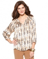 This no-fuss blouse features a relaxed silhouette and modern print for everyday chic, from Ellen Tracy.