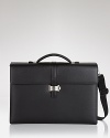 Crafted from black southern German full-grain calfskin, this double-gusset briefcase is sleek and fully loaded with pockets for your PDA, 2 writing instruments, and small and medium documents. Unique flap closure with 2 locking options.