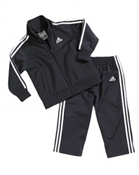Adidas iconic sporty style infuses the zip jacket and matching pant, creating a cool, comfortable look for the playground and ball court alike.