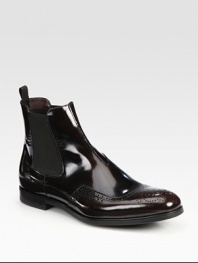 Leather Chelsea boot design with wing-tip detail and side goring.Leather upperLeather liningRubber soleMade in Italy