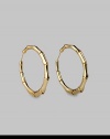 Bold bamboo-textured hoops, exquisitely crafted of gleaming 18k yellow gold. 18k yellow gold Diameter, about 2¼ Pierced Made in Italy
