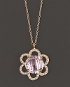 Pavé diamonds blossom around a 18K gold flower, centered with faceted rose of France. By Carelle.