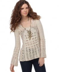In a deconstructed open-stitch knit, this Free People sweater adds a relaxed boho vibe to any outfit!