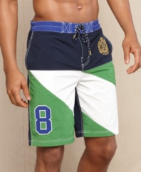 Pieced striping and a classic crest makes this trunks from Tommy Hilfiger your most stylish swimwear.