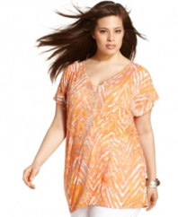 Give your casual wardrobe a kick with INC's short sleeve plus size top, broadcasting a vibrant print!