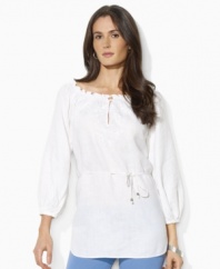 This breezy Lauren by Ralph Lauren tunic is rendered in lightweight linen with delicate embroidery and smocking at the neckline for a bohemian look.