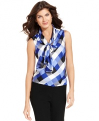 Nine West's classic tie-front blouse gets a fresh look with a chic checked pattern that's perfect for adding punch to your work wardrobe.
