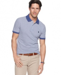 Classic simplicity in a modern cut. This slim-fit polo shirt from Izod will easily become a mainstay in your wardrobe. (Clearance)