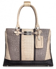 An untamed style with refined appeal. This crocodile print design from GUESS features sleek silver-tone hardware, signature front detail and a spacious tote silhouette.
