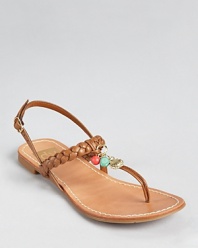 Playful charms accent a thong sandal silhouette from Dolce Vita, adorned with braided details in smooth leather.