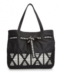 An indie-chic design with tribal-inspired accents. This eye-catching tote from Danielle Nicole features whip stitch detailing, a belted top and a classic tote shape.