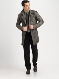 Double-breasted coat with trench-style aesthetics, featuring shoulder epaulettes and buckle closure at the collar, finished in a burnished leather, for an uptown meets downtown feel.Double-breasted button-frontShoulder epaulettesBelted waistRear ventFully linedAbout 36 from shoulder to hemLeatherDry cleanImported