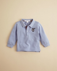 Burberry's soft pique cotton polo is rendered in classic form, with a large embroidered logo at the left chest and check trim inside the placket.