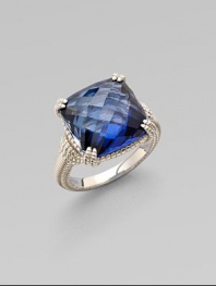 Cushion-cut blue corundum sparkles in a delicate sterling silver setting.Blue corundumSterling silverWidth, about ½Imported