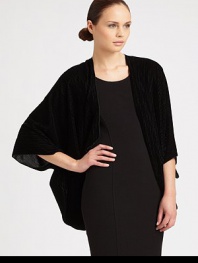 An ultra-plush, velvet-y soft shrug with chic stripes.70% viscose/23% silk/7% polyesterAbout 80 X 115Dry cleanImported