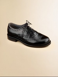 Constructed in the softest leather, this classic oxford is designed in a lace-up silhouette with intricate cut-out details.Lace-upLeather upperLeather liningRubber solePadded insoleImported