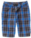 Sporting a summer plaid print, these walkshorts from Quiksilver add a crisp yet casual style to his look.