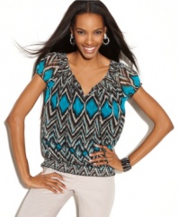 A bold tribal print and a splash of bright color gives INC's peasant top a fresh feel for spring!