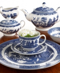 The classic Willow Blue china pattern, first popularized in England more than 200 years ago, marvelously decks this fine Johnson Bros. dinnerware and dishes set. The great attention to detail in every last piece is sure to make dining an engaging affair.